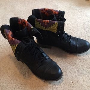 Black boots with tribal print inset